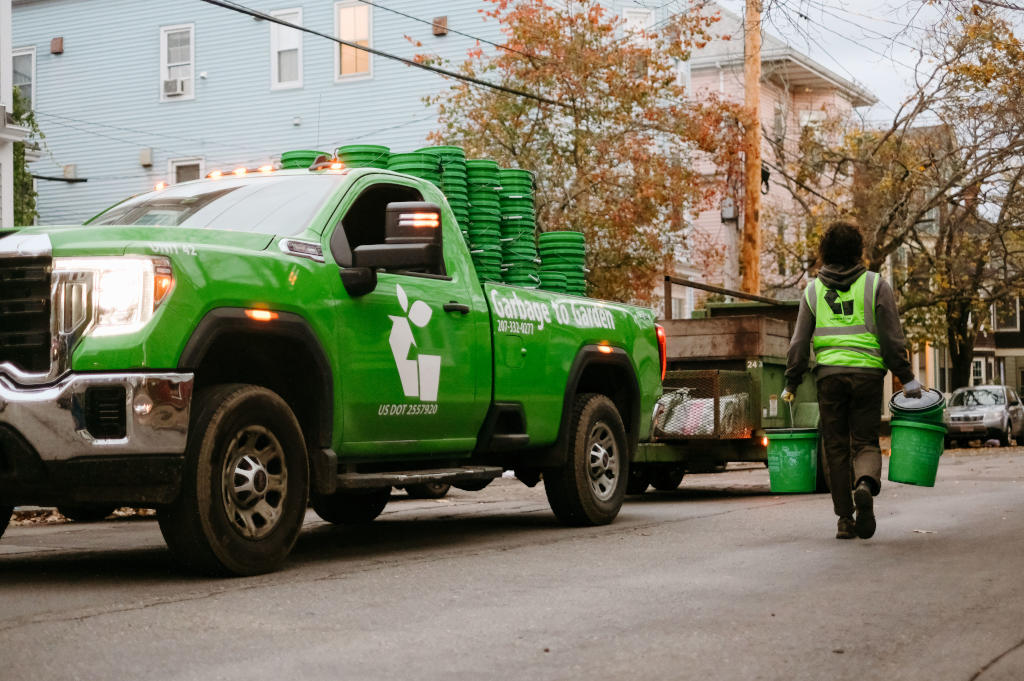 Food scraps being composted, illustrating the transformation of food waste into rich organic compost for Maine gardens